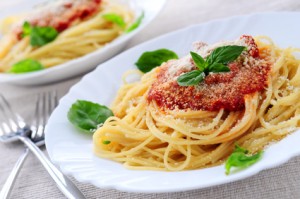 Pasta with tomato sauce basil and grated parmesan